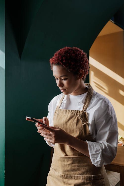 Restaurant owner checking phone after hours