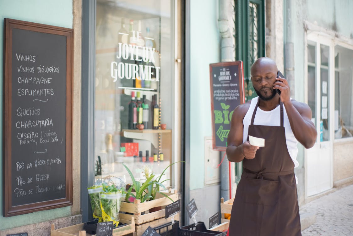 Restaurant owner answering phone call
