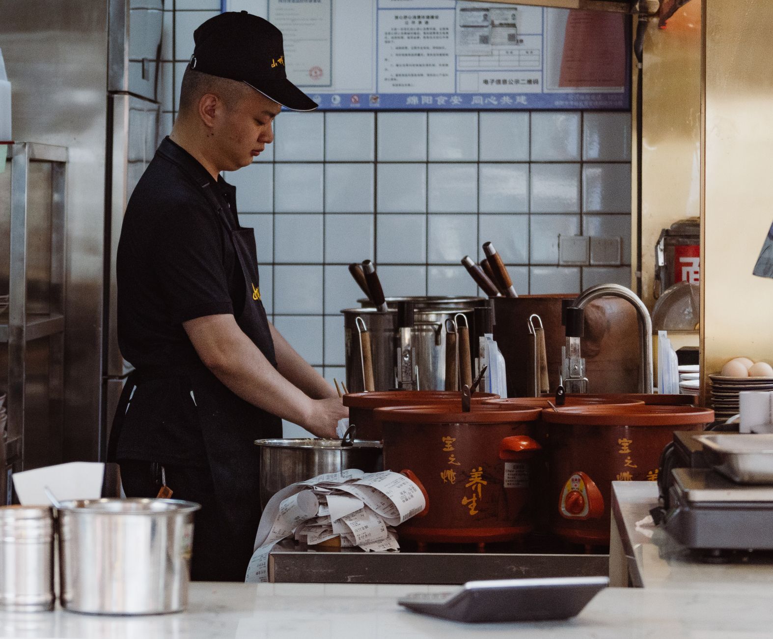 Professional chef working alone in a restaurant kitchen. Photo by 女子 正真 on Pexels